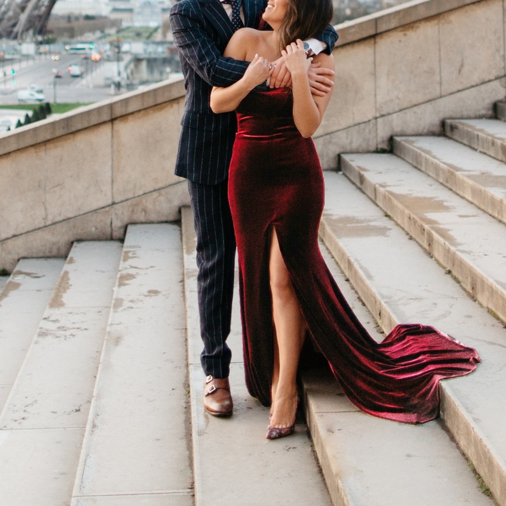 Aqua dresses burgundy gown.